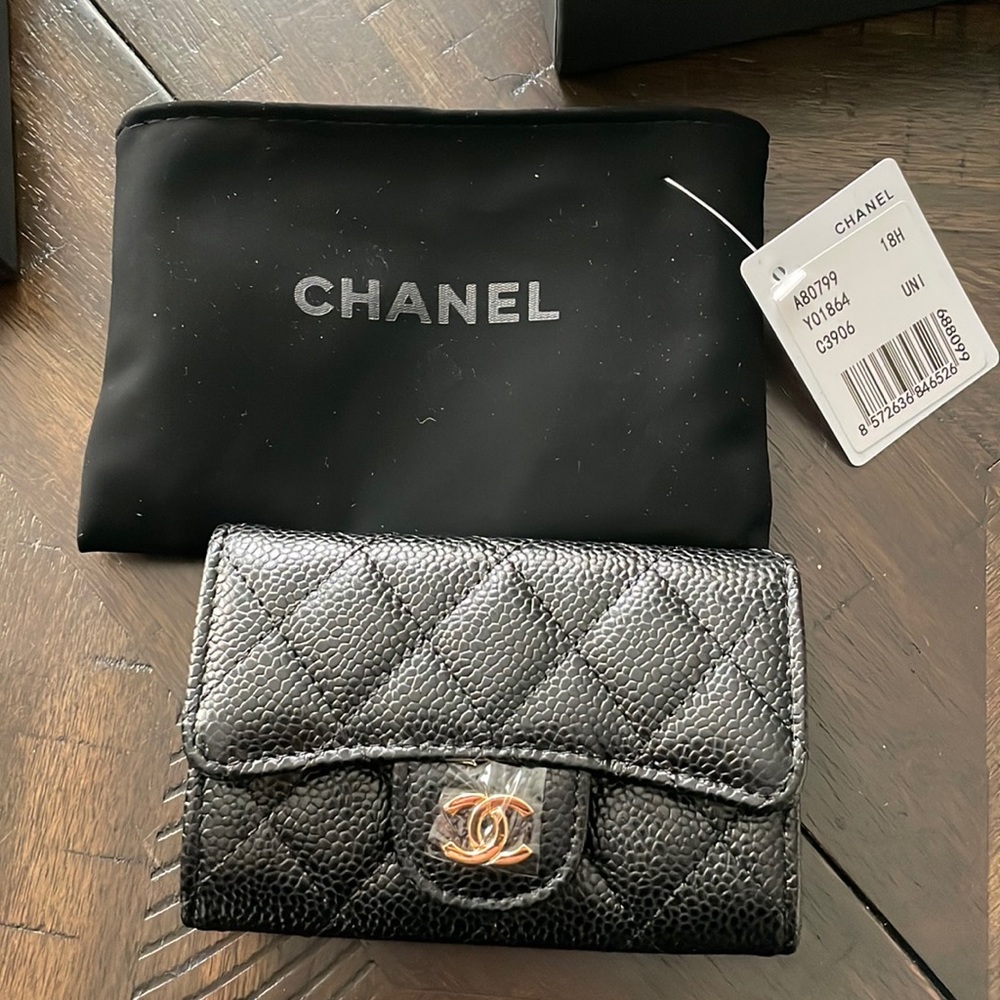 Brand new Chanel wallet. Still has plastic on it.